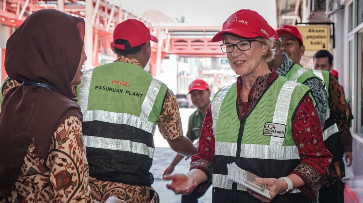 Coca-Cola Amatil Group Managing Director Alison Watkins with members of the ASSP bottling team in Pasaruan, Indonesia